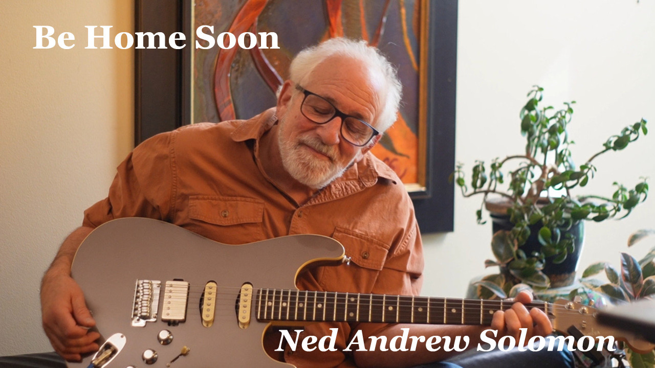 Be Home Soon thumbnail with Ned Andrew holding a gray electric guitar